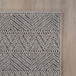 dywan-nowoczesny-3d-helix-boho-szary-zblizenie-rogu-dywanu-z-widocznym-obszyciem-obu-bokow.jpg