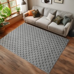 dywan-nowoczesny-3d-helix-szary-aranzacja-na-ciemnej-podlodze-z-jasna-sofa.jpg