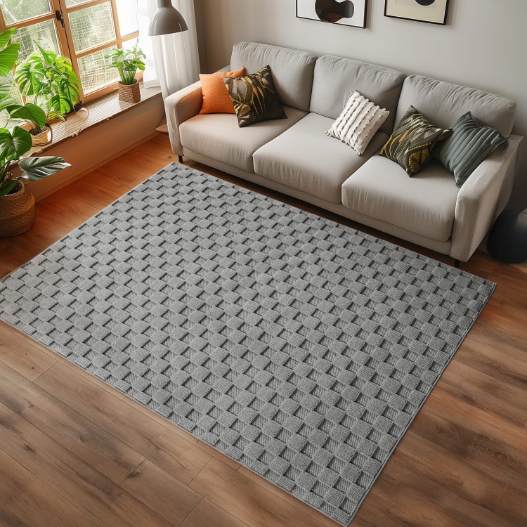 dywan-nowoczesny-3d-helix-szary-aranzacja-na-ciemnej-podlodze-z-jasna-sofa.jpg